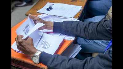 An official checks the documents at a centre File 1769181722846