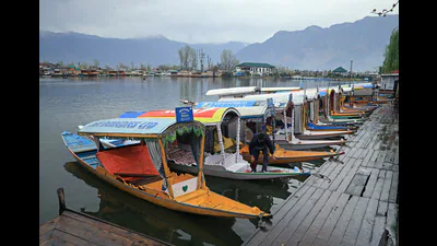 Boats are anchored along the shore of Dal Lake in 1773253091621