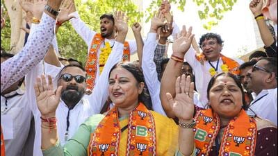 Bharatiya Janata Party supporters celebrate the re 1777438155847