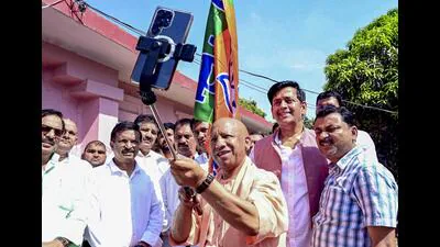 Chief minister Yogi Adityanath takes a selfie with 1775481917084