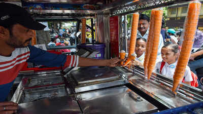 ranchi apr 21 ani students buy ice cream after school dismissal on a hot sun