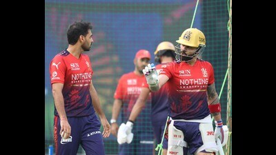 Bhuvneshwar Kumar left and Virat Kohli right c 1778008785041