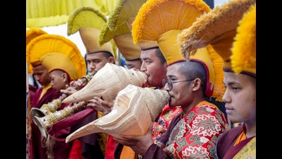 Buddhist monks blow ceremonial conch shells during 1777665609101