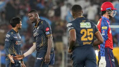 Gujarat Titans Jason Holder interacts with captai 1777832860039