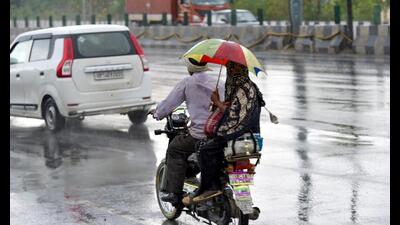 People are seen enjoying light rain along NH 9 nea 1778079274675