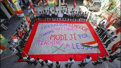 School students hold national flags around a rango 1778152570022