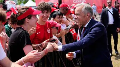 Canada Prime Minister Mark Carney greets attendees 1782982661720