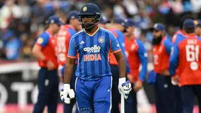 India s Sanju Samson C walks off after being dis 1783434853480